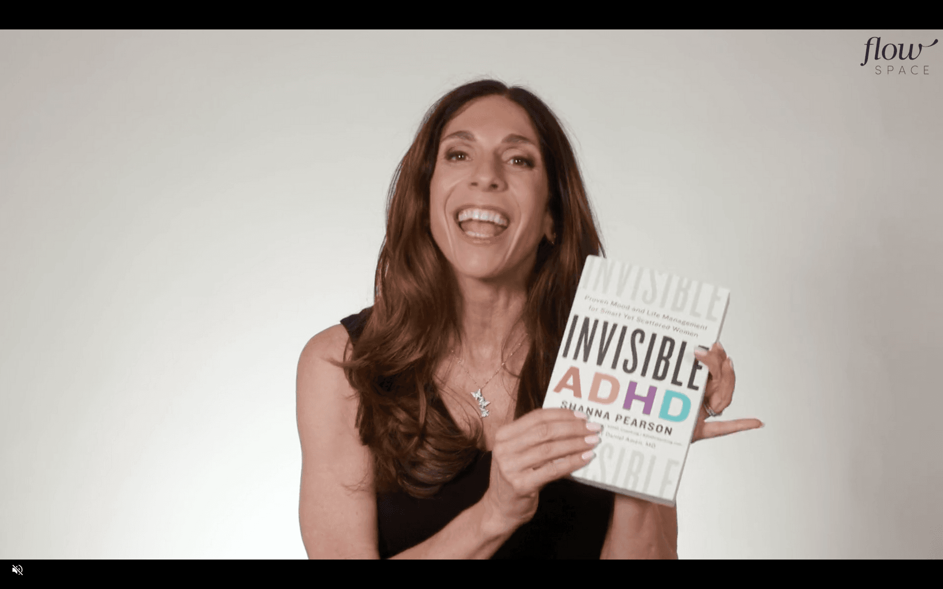 Shanna Pearson holding Invisible ADHD book